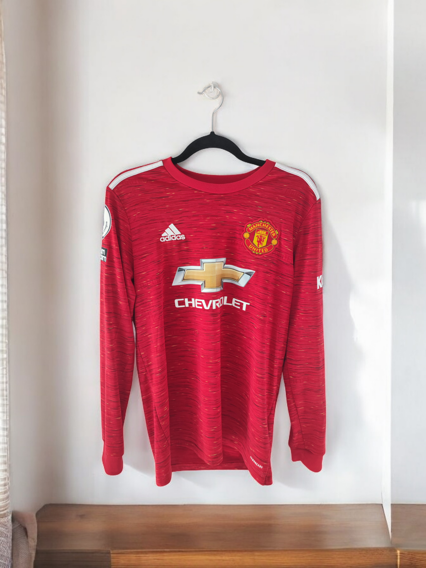 MAILLOT MANCHESTER UNITED 2020/2021 MANCHES LONGUES FLOQUÉ BRUNO FERNANDES 18#
