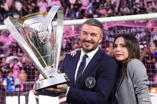 David Beckham and Victoria Beckham with MLS trophy