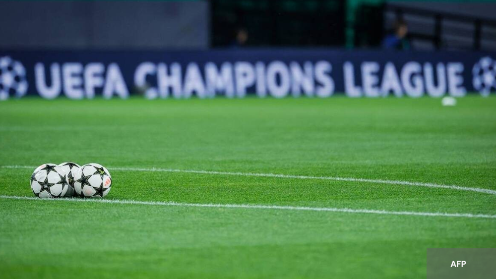 Three balls of champions League on first plan in background sentence UEFA Champions League 